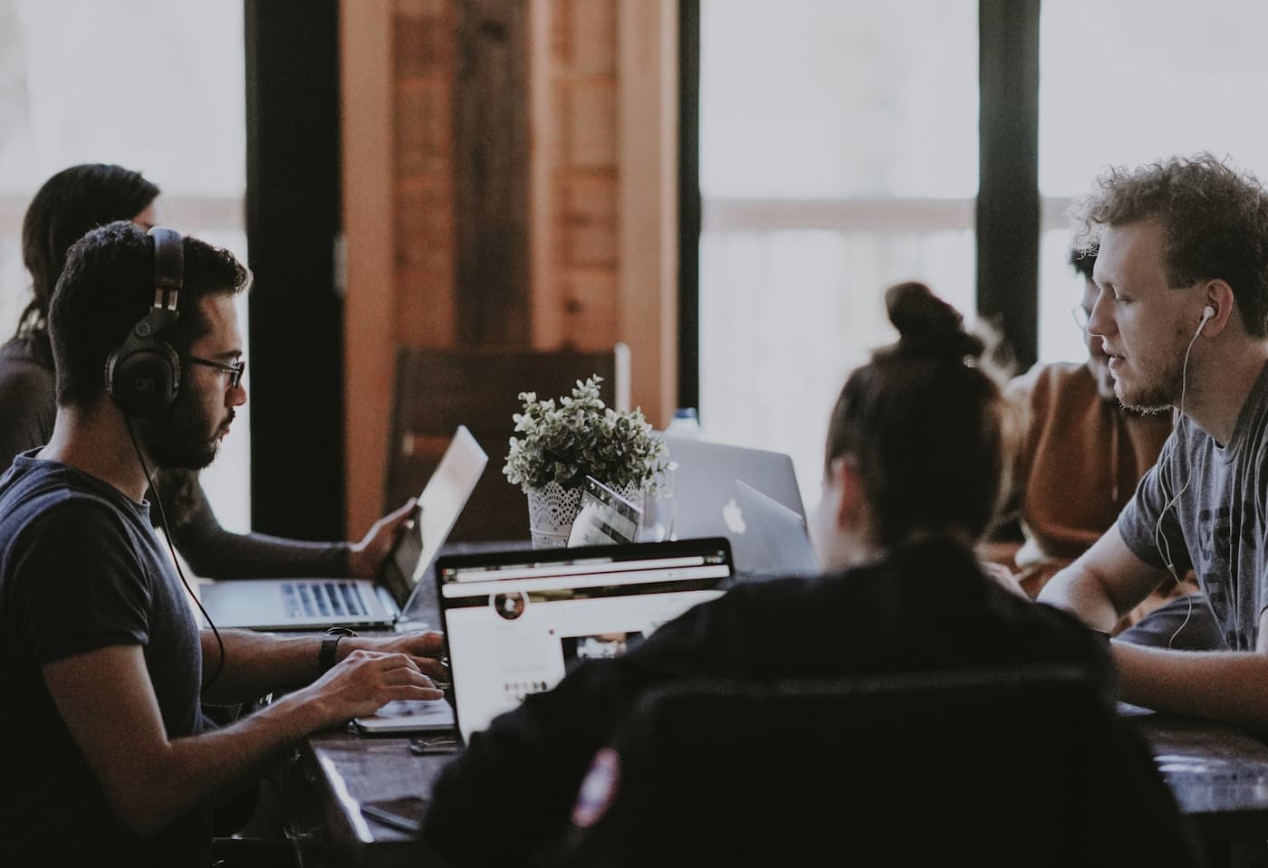 A team of clinicians and professionals working collaboratively in an office setting.
